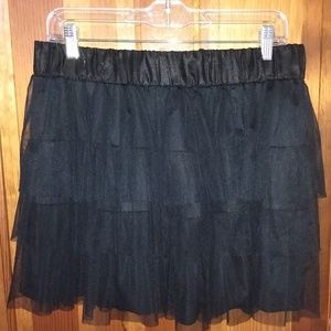 Black ruffled mini skirt